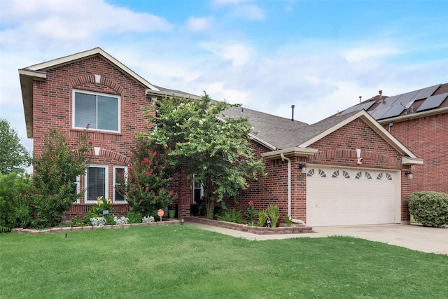 view of front of house featuring a garage and a front lawn