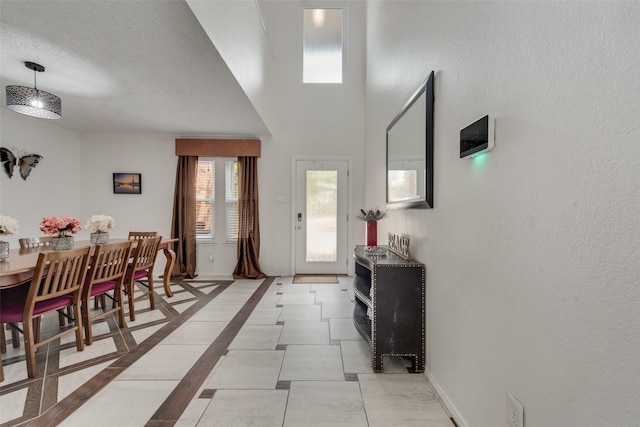 foyer with a textured ceiling