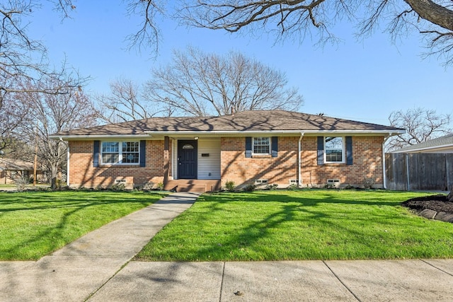 ranch-style house featuring a front yard