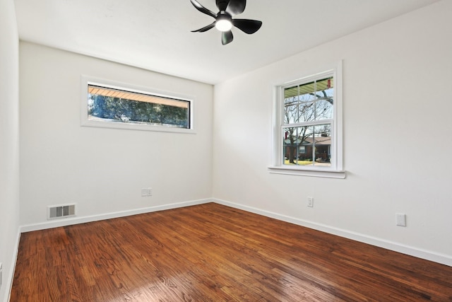 empty room with ceiling fan and hardwood / wood-style floors