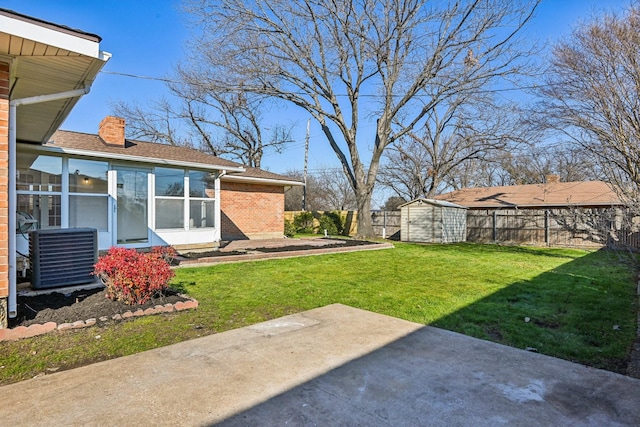 view of yard with a patio, a storage unit, central AC, and a sunroom