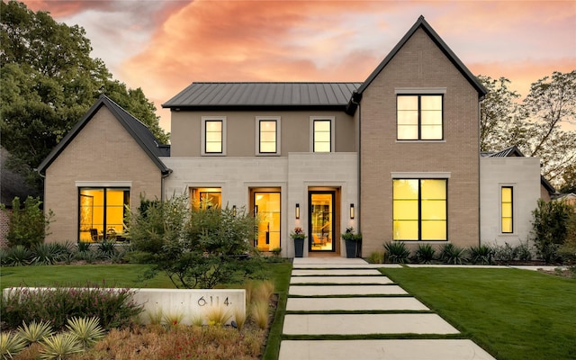 view of front of home with a lawn