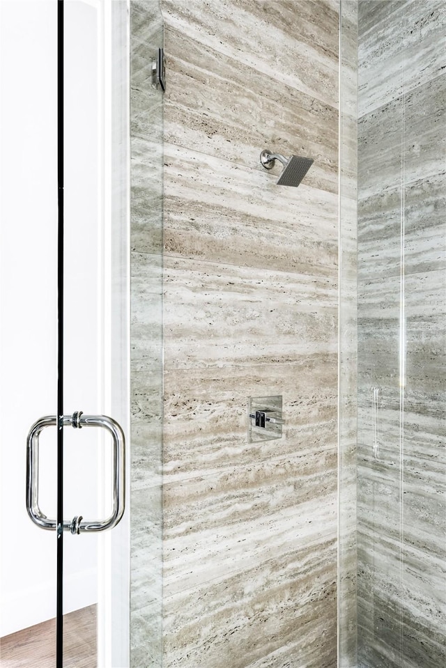 interior details featuring an enclosed shower