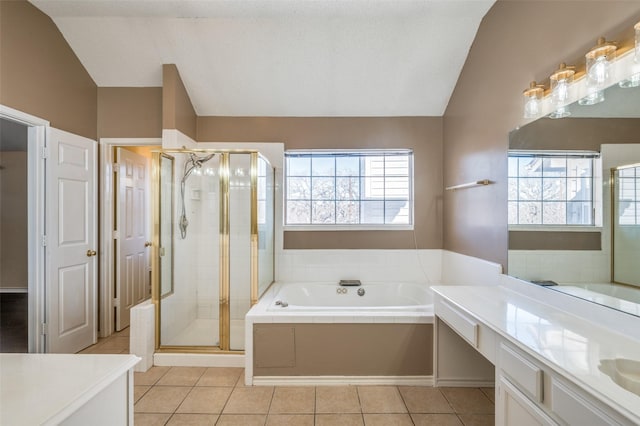 bathroom featuring shower with separate bathtub, vanity, tile patterned floors, and vaulted ceiling