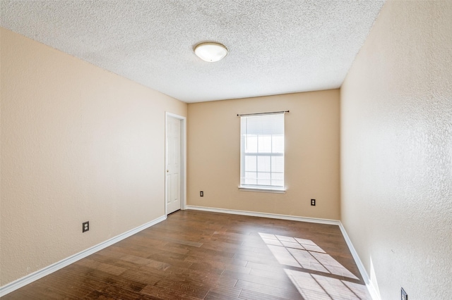 unfurnished room featuring a textured ceiling and hardwood / wood-style flooring