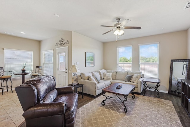 living room with hardwood / wood-style flooring and ceiling fan