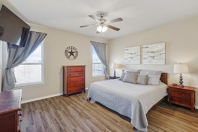 bedroom with hardwood / wood-style flooring and ceiling fan