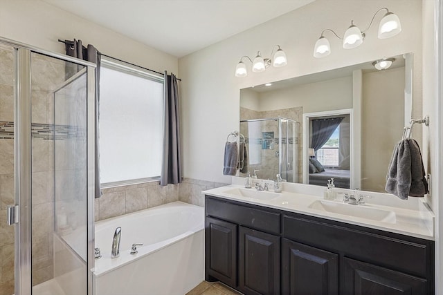 bathroom featuring tile patterned flooring, plenty of natural light, vanity, and plus walk in shower