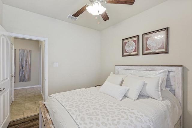 bedroom featuring ceiling fan and dark wood-type flooring