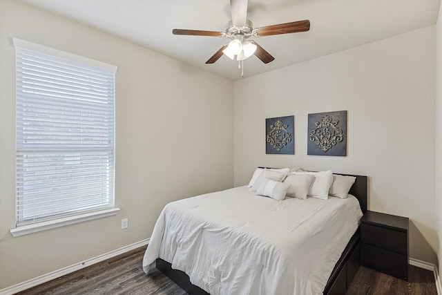 bedroom featuring ceiling fan and dark hardwood / wood-style flooring