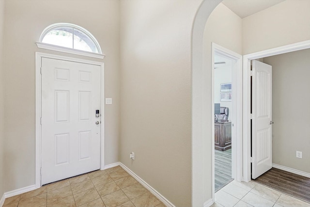 foyer entrance with light tile patterned floors