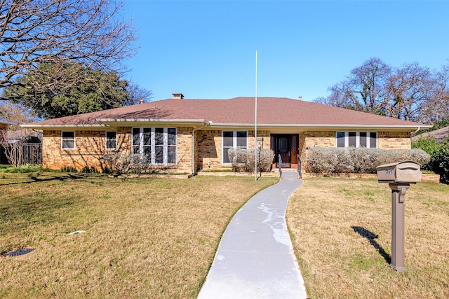 ranch-style home featuring a front yard