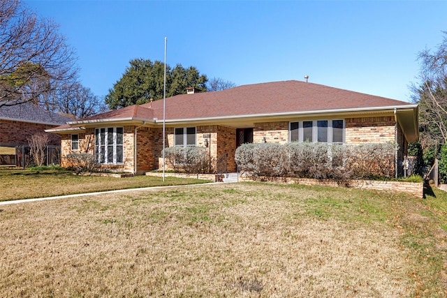 ranch-style house featuring a front yard