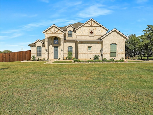 french provincial home with a front lawn