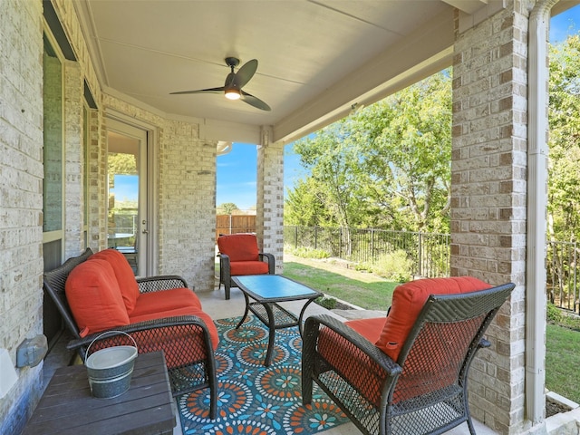 view of patio / terrace featuring ceiling fan and an outdoor living space