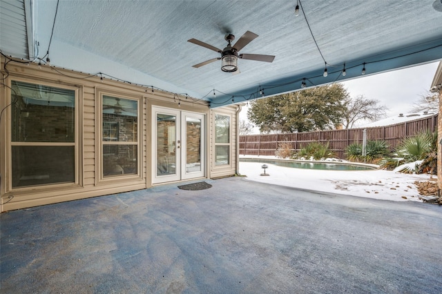 view of patio with ceiling fan and french doors