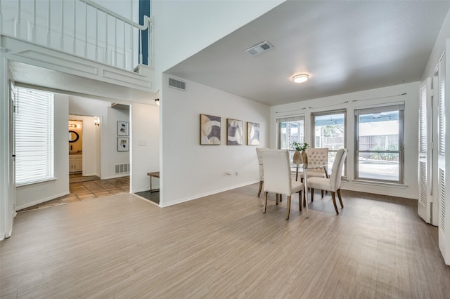 dining area with hardwood / wood-style flooring