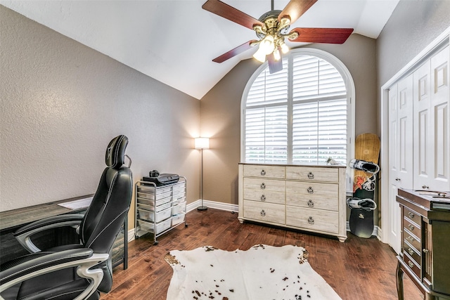 office area featuring ceiling fan, dark wood-type flooring, and lofted ceiling