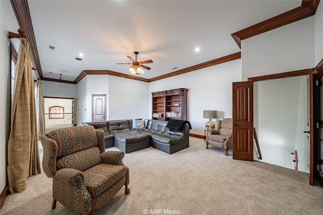 carpeted living room with ceiling fan and crown molding