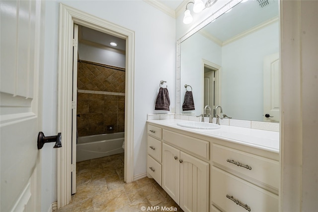 bathroom featuring vanity, tiled shower / bath combo, and ornamental molding