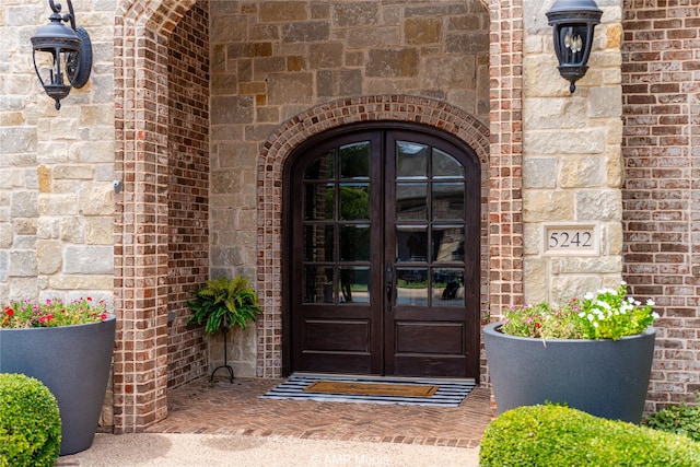 entrance to property featuring french doors