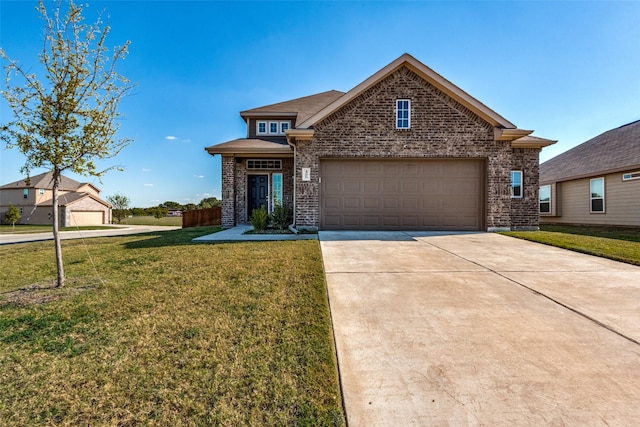 view of front of home with a front yard and a garage