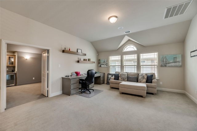 office with light colored carpet, wine cooler, and vaulted ceiling