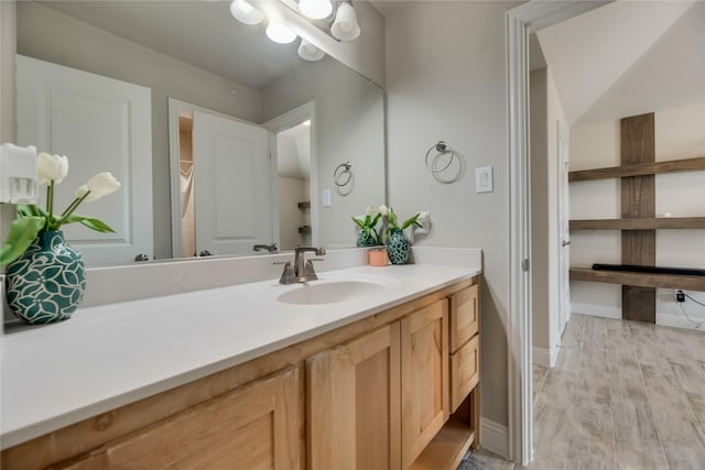 bathroom with vanity and wood-type flooring