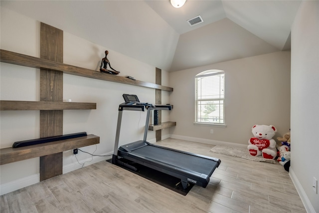 exercise room with lofted ceiling