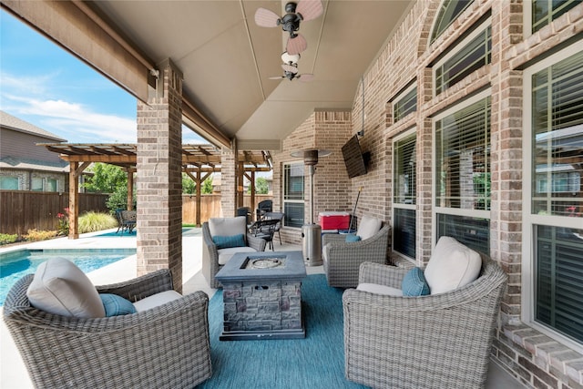 view of patio / terrace with a pergola, ceiling fan, a fenced in pool, and an outdoor fire pit