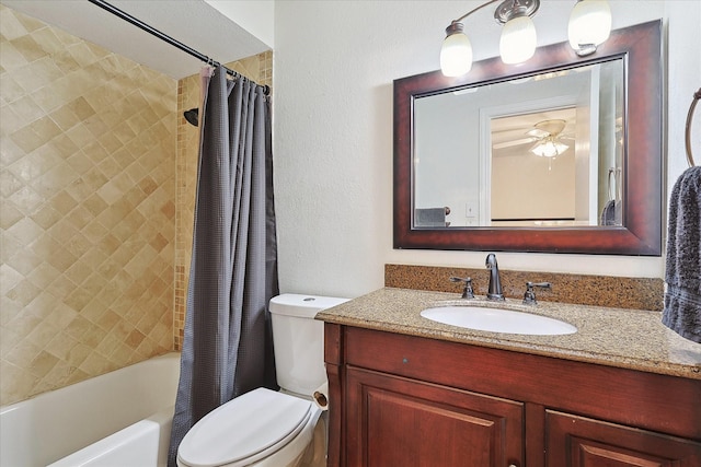 full bathroom with ceiling fan, vanity, shower / tub combo, and toilet