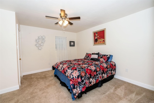 bedroom featuring ceiling fan and light carpet