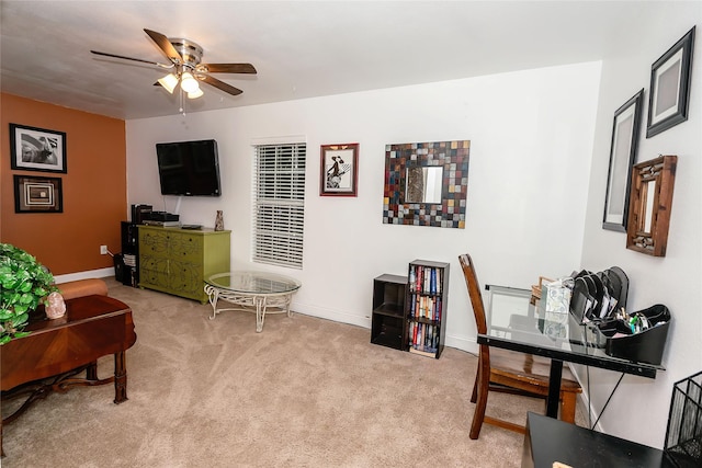 carpeted office featuring ceiling fan