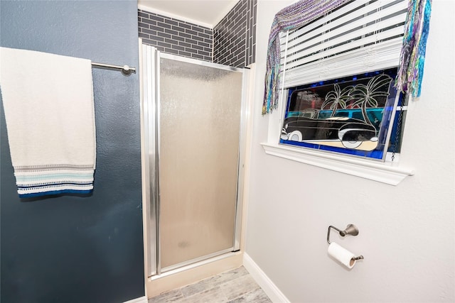 bathroom featuring an enclosed shower