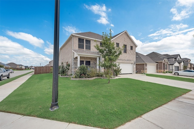 view of front facade featuring a front yard and a garage