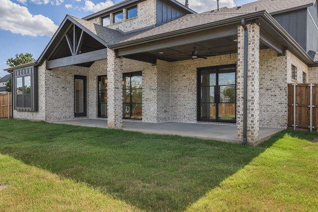 rear view of house featuring a lawn, a patio area, and ceiling fan