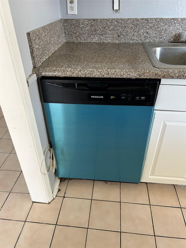 room details featuring dishwasher, white cabinetry, and sink