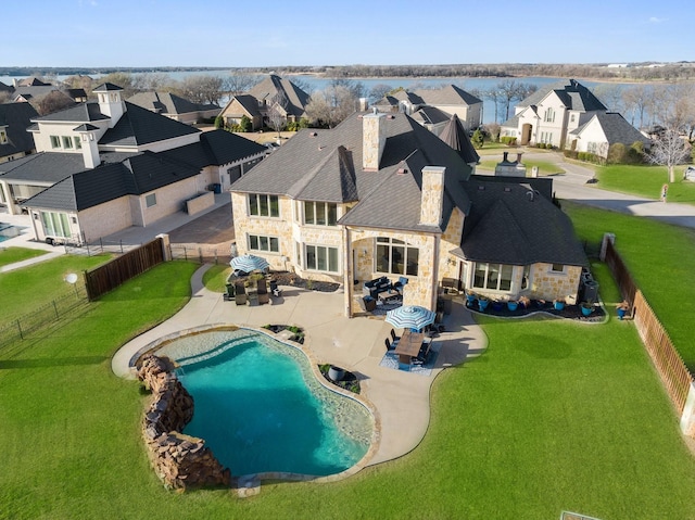 view of swimming pool featuring an outdoor living space, a patio area, and a yard