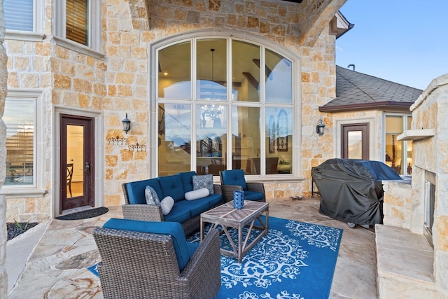 view of patio / terrace with outdoor lounge area and a grill