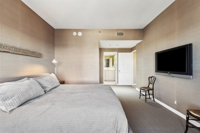 bedroom with carpet floors and ensuite bath