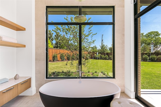 interior space featuring tile walls and a healthy amount of sunlight