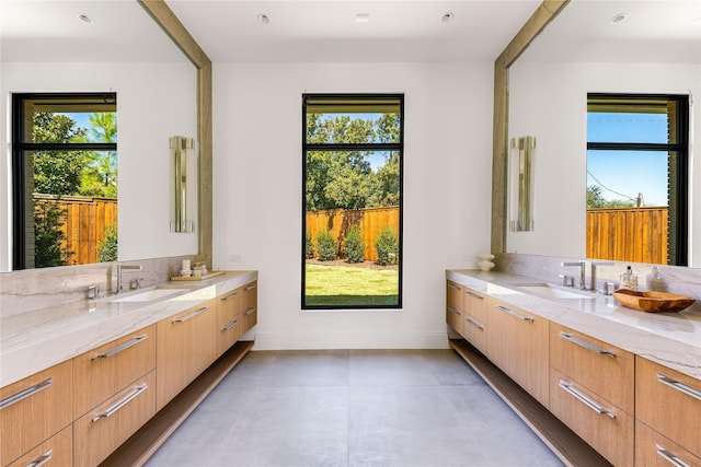 bathroom with vanity and plenty of natural light