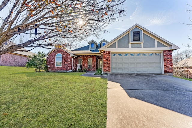 view of front of house featuring a front yard and a garage