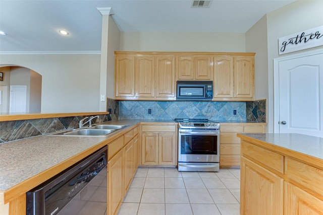 kitchen featuring light brown cabinets, sink, and appliances with stainless steel finishes