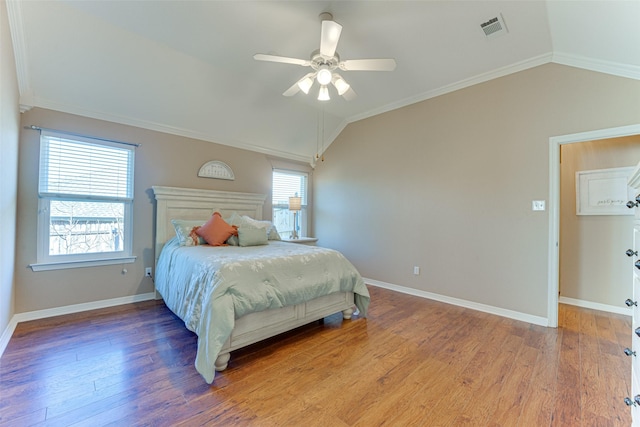 bedroom with ceiling fan, crown molding, and lofted ceiling