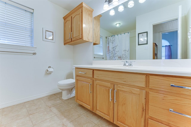 bathroom featuring a shower with shower curtain, vanity, and toilet