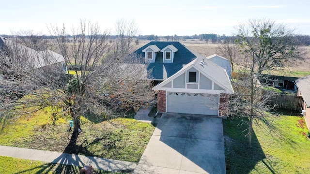 view of front of property with a front yard and a garage