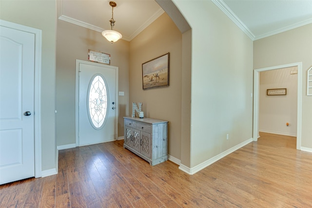 entryway featuring light hardwood / wood-style floors and ornamental molding