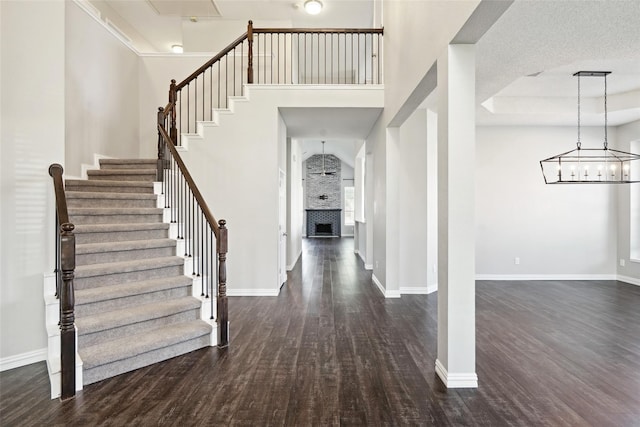 entryway with a textured ceiling and dark hardwood / wood-style floors