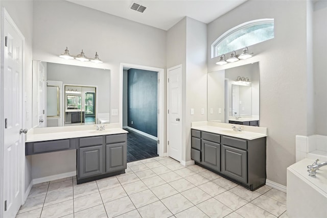 bathroom featuring tile patterned floors, plenty of natural light, and vanity